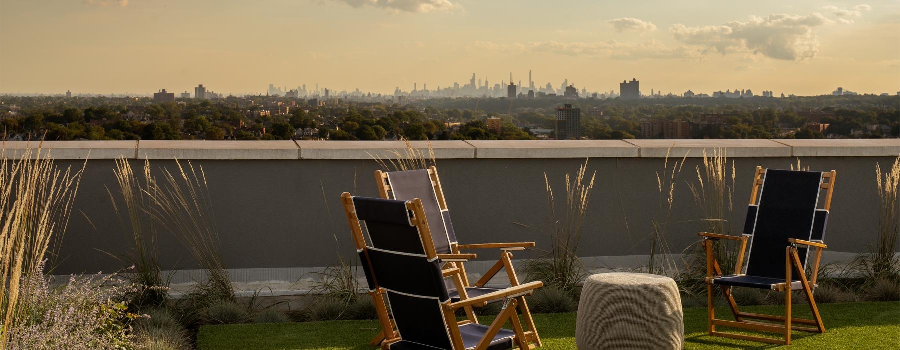 chairs on a lawn overlooking a body of water